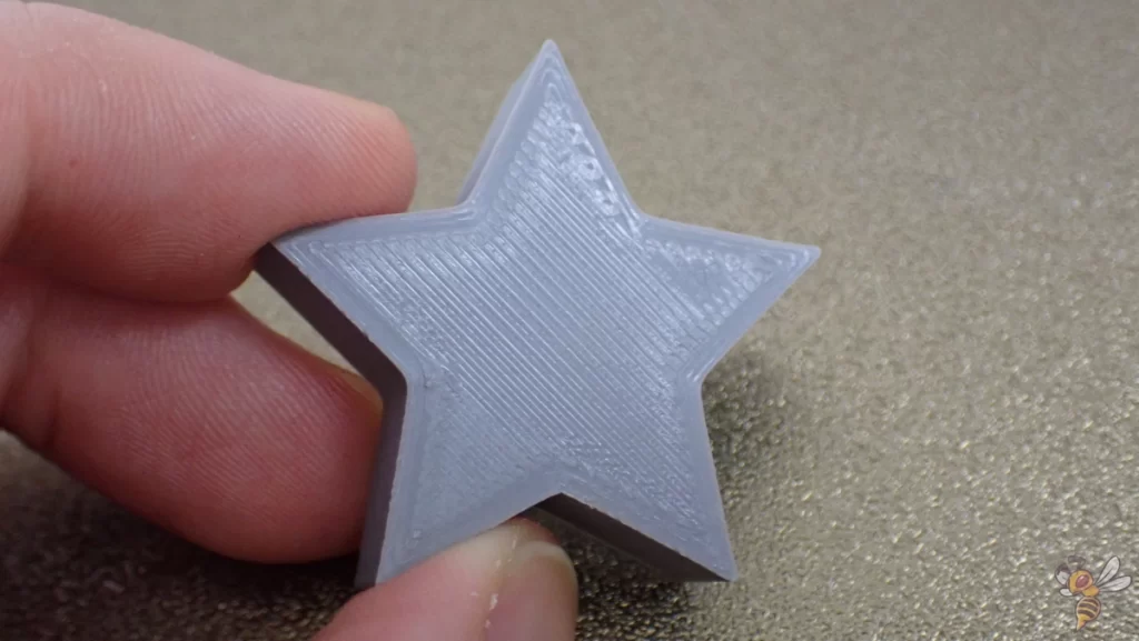 Photograph of the top layer of a 3D print that was printed without the Cura Ironing feature. 